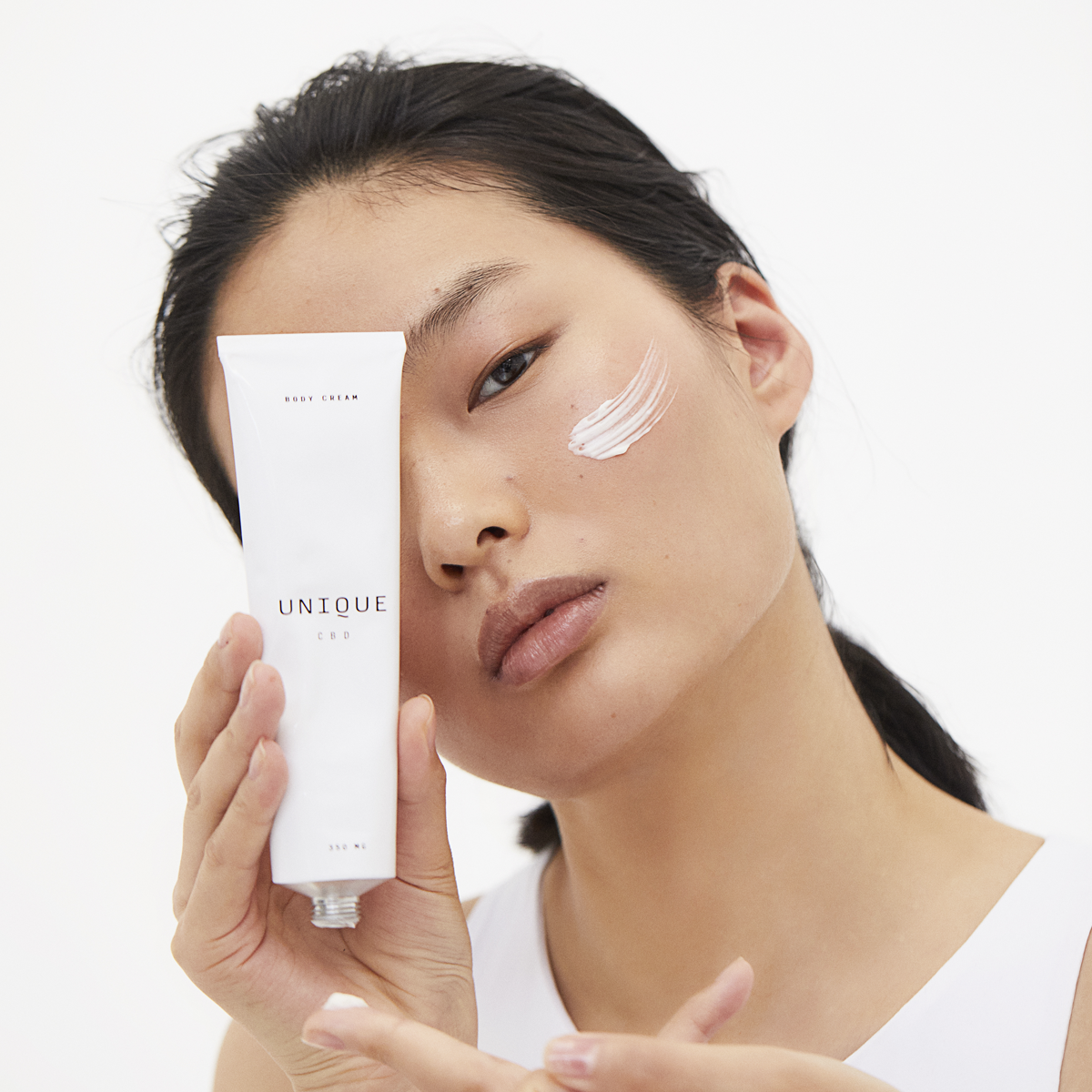 Unique CBD Body cream in hands of model